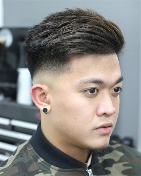 Fade haircuts asian - Korean men’s hairstyles usually feature long, shaggy layers combined with a fade cut or patterned with a clipper or scissor design. With its unkempt and tousled aesthetic, the style is far from the more formal and groomed look of other Asian men’s hairstyles. Korean hairstyles also offer a wide range of styles that can suit just about any guy.